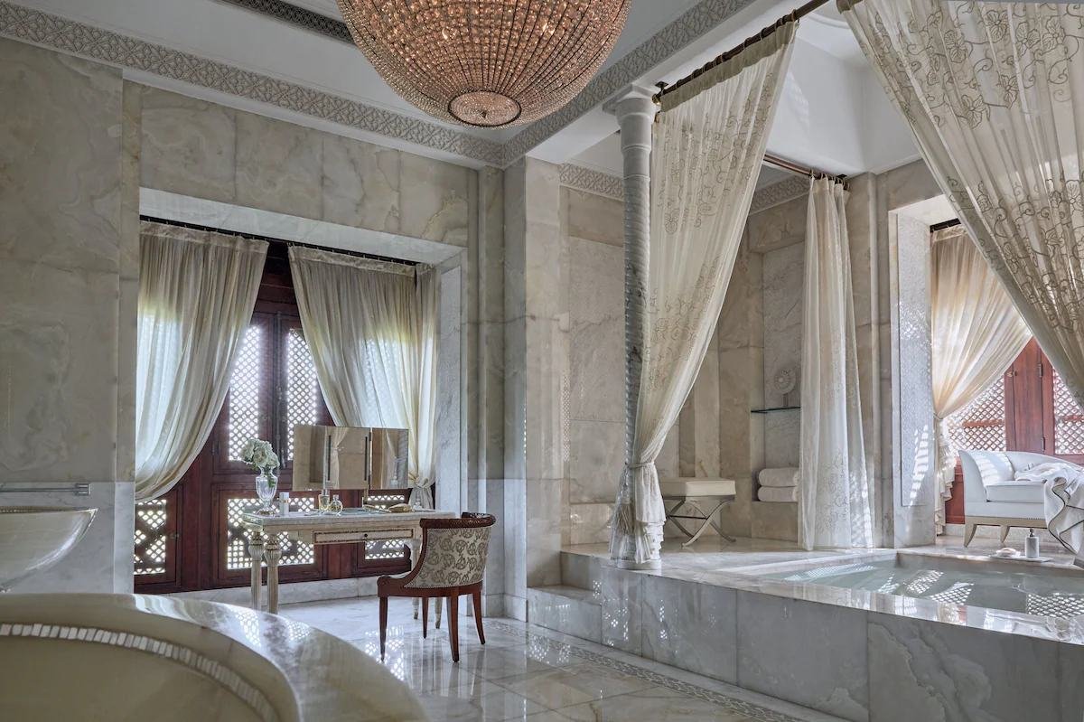 Marble bathroom with a private plunge pool in a palace suite in Marrakech